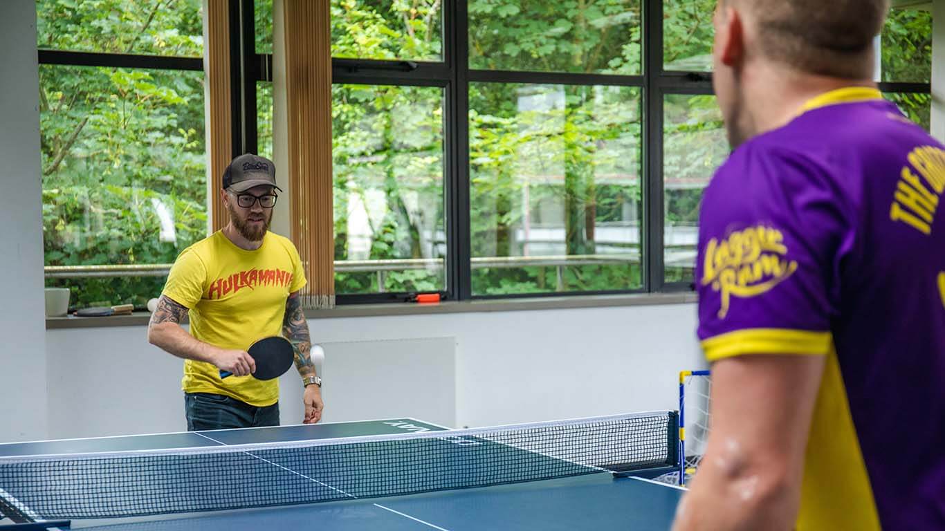 Organic team playing ping pong
